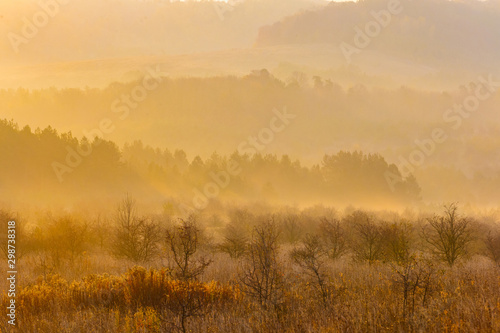Seasons change in mountains  morning landscape. Golden light in nature concept