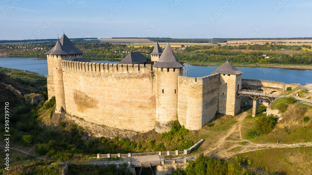 Aerial view of old castle near the River. Hotyn Castle in Ukraine. Eastern Europe.
