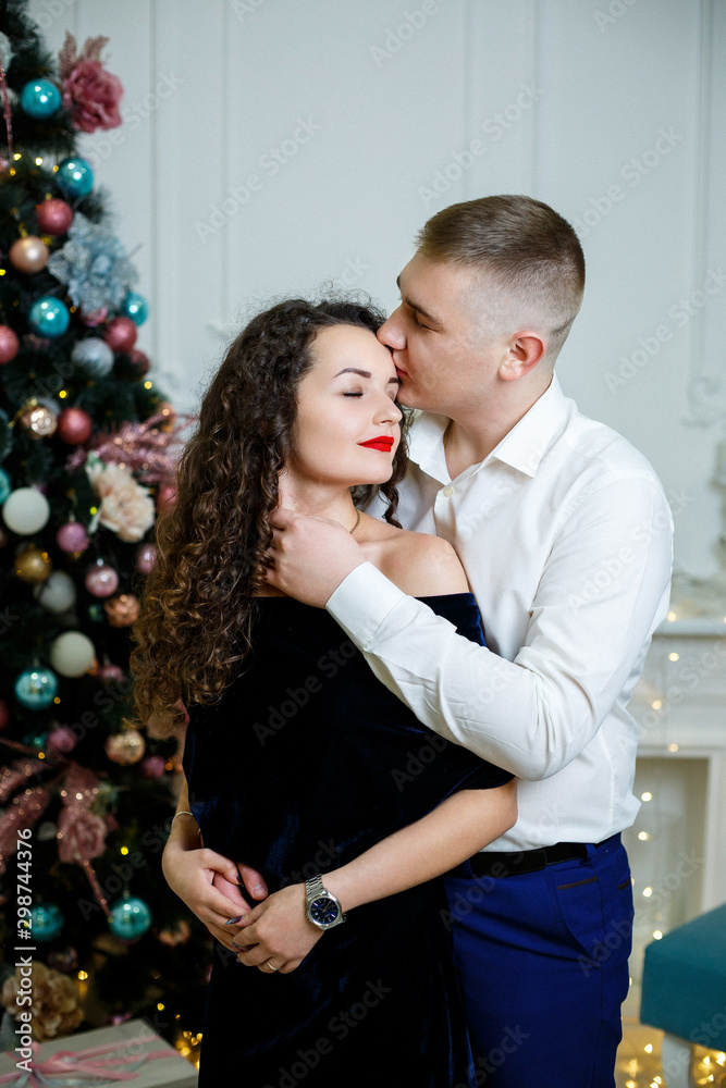 couple of lovers in the New Year decorations couple of lovers in the New Year decorations