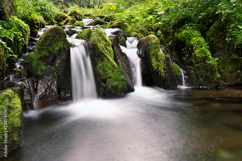 Fototapeta Naklejka Na Ścianę i Meble -  Small waterfall on the river with rocks.