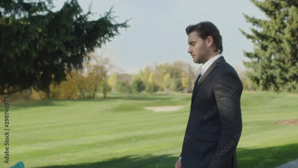 Business woman and business man are talking on the background of the park Business woman and business man are talking on the background of the park