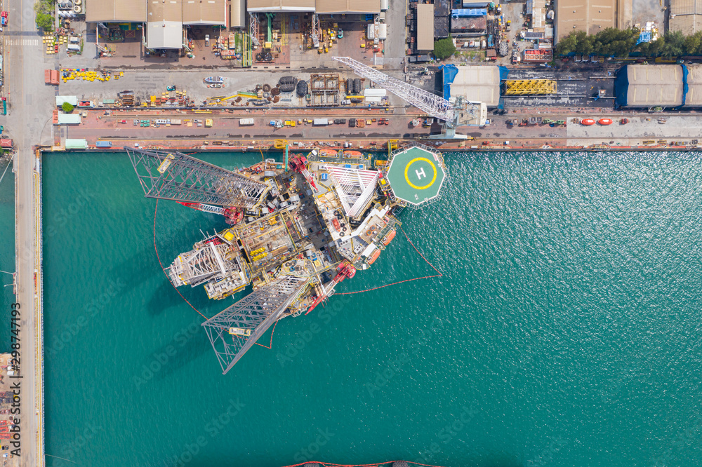Aerial view of a jack up oil drilling rig and dry dock ship in the ...