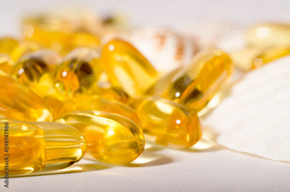 Omega 3 capsules. Supplement food capsules with oil of nordic fish oil. Vitamins and tablets against white. Omega 3 capsules. Supplement food capsules with oil of nordic fish oil. Vitamins and tablets against white.