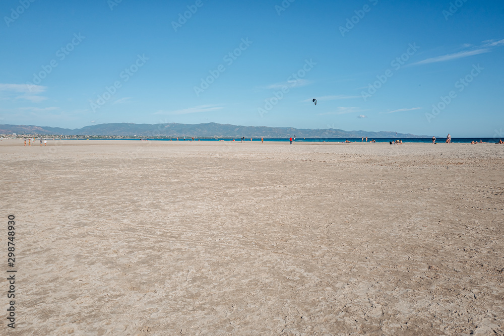 CAGLIARI, SARDINIA / OCTOBER 2019: The beautiful sand beach of Poetto CAGLIARI, SARDINIA / OCTOBER 2019: The beautiful sand beach of Poetto
