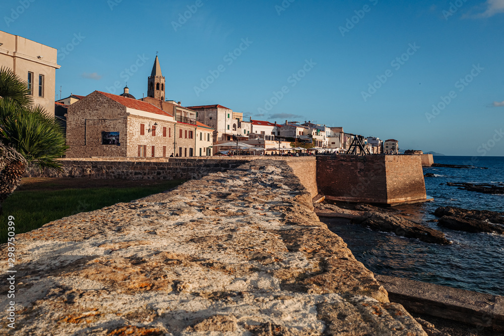 ALGHERO, ITALY/ OCTOBER 2019: Wonderful sunset over the ancient fortifications ALGHERO, ITALY/ OCTOBER 2019: Wonderful sunset over the ancient fortifications