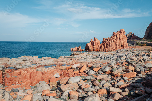 ARBATAX, ITALY / OCTOBER 2019: The scenic red rocks beach in Sardinia, Ogliastra region