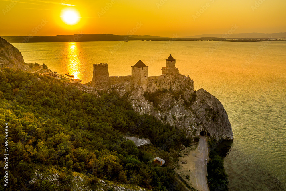 Silhouette of Golubac castle during sunset in Serbia along the Danube 
