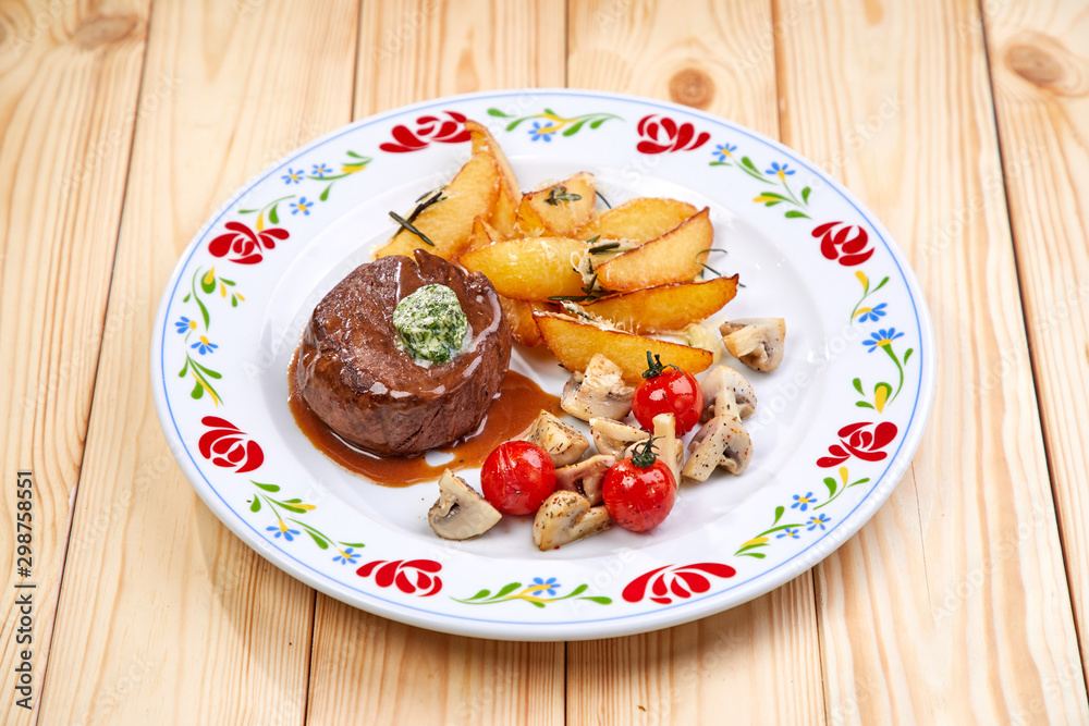 steak with baked potatoes and mushrooms