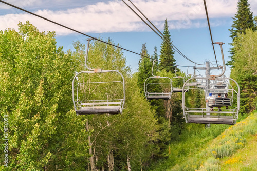 Chairlifts at a ski resort in Park City Utah on a sunny day during off season