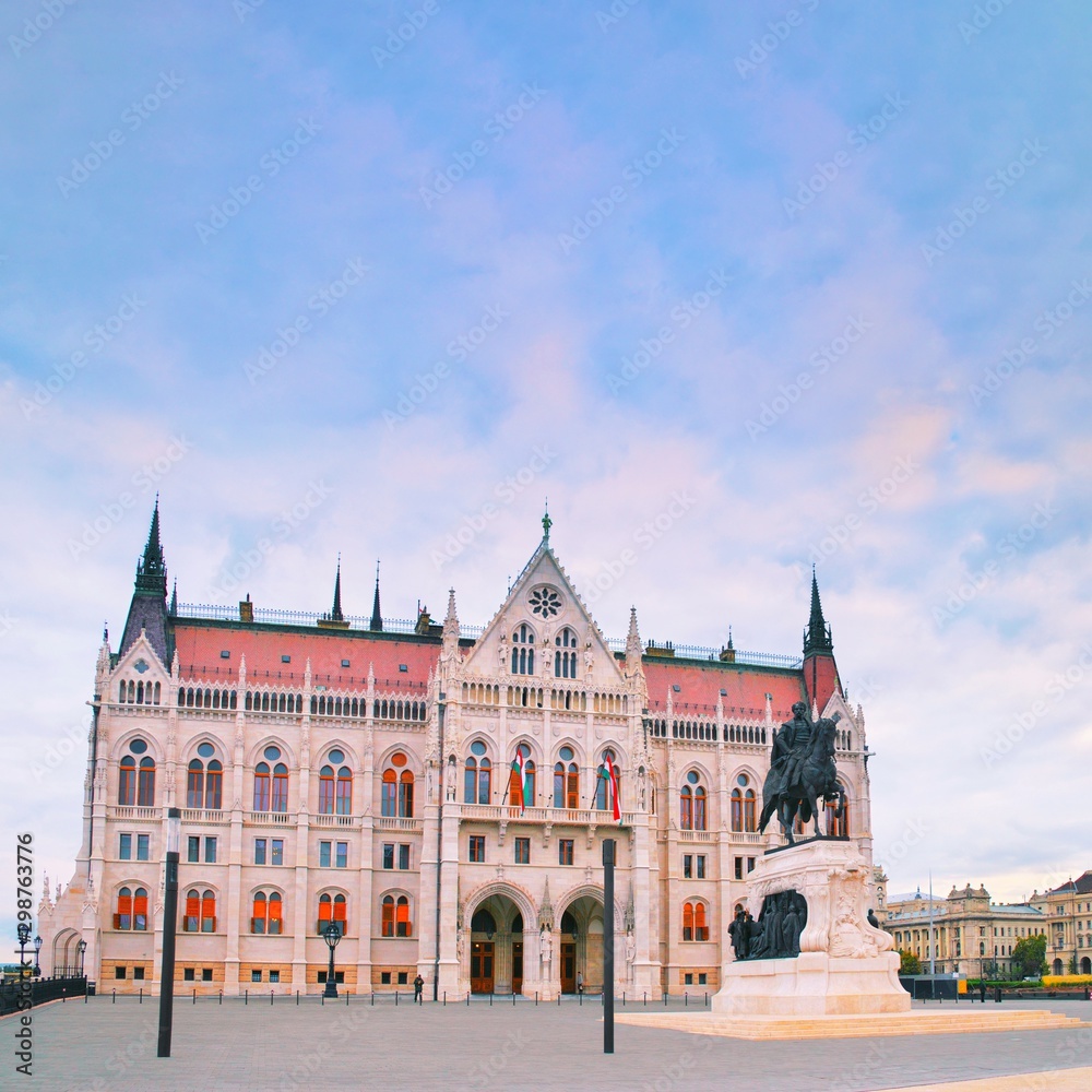 Fototapeta premium Budapest, Hungary government. Statue monument of Count Gyula Andrassy on the Parliament Square in front of Beautiful building of Hungarian Parliament in Budapest, popular Europe travel destination.