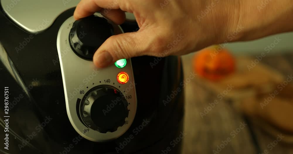 Turning on air fryer to make camping treat S'mores Turning on air fryer to make camping treat S'mores