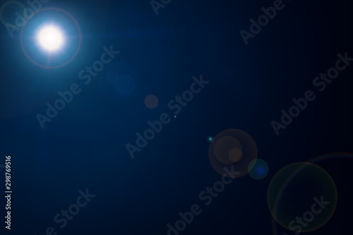 summer sun with sunshine on dark blue sky background texture