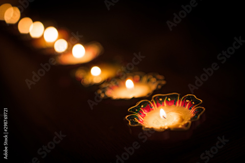 Diwali Diyas in a row angle shot