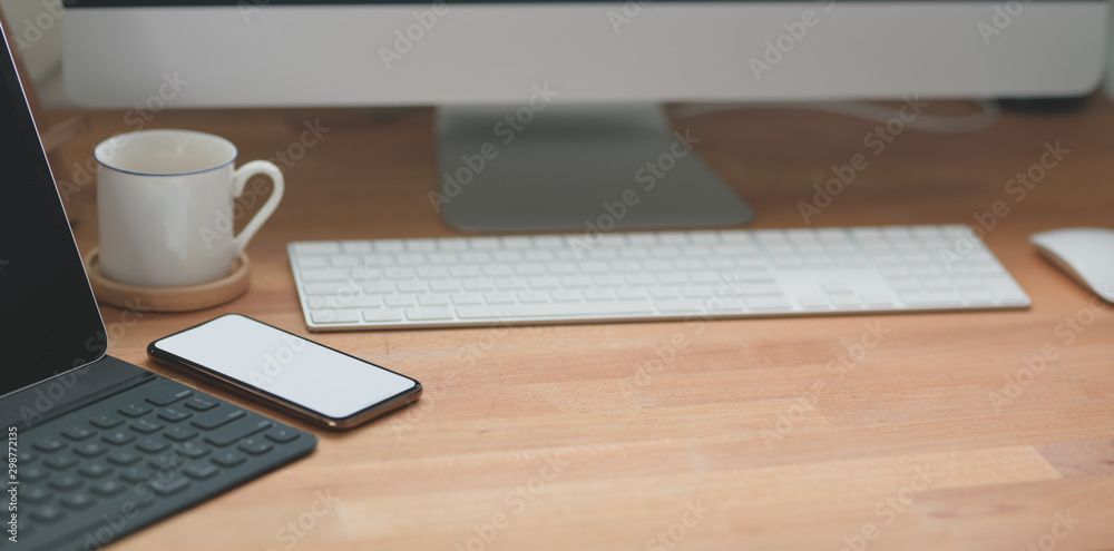 Cropped shot of modern workspace with office supplies and desktop computer Cropped shot of modern workspace with office supplies and desktop computer