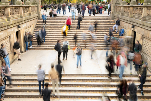 Overhead view of busy crowds of people walking up and down the steps at Bethesda Terrace in Central Park, New York City
