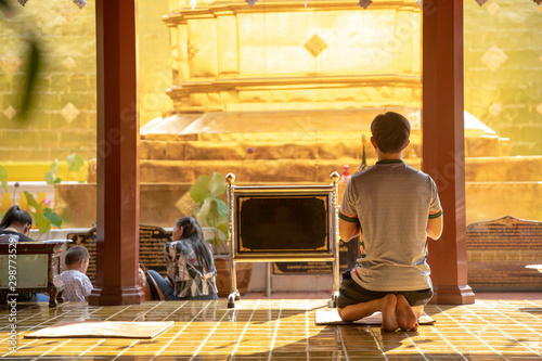 Thai buddhism people in buddhist pray for benefaction worship to Buddha at  temple