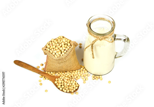 Soybean on wooden spoon and dried soy beans in the sack isolated on white background - Soy milk in glass jar for healthy diet and natural bean protein