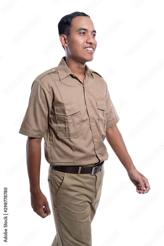 Fototapeta premium gesture of young man in uniform walking isolated over white background