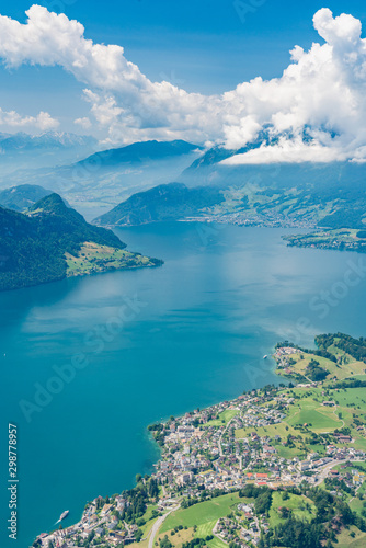 Switzerland, Panoramic view on green Alps in clouds and lake Lucerne