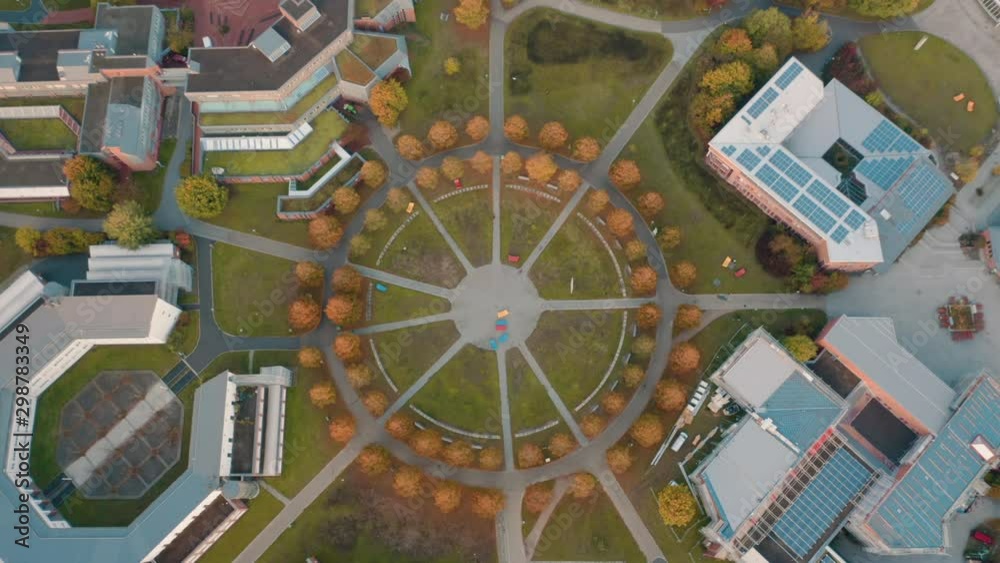 Aerial shot from up above of University Bayreuth Campus with beatufil sunrise ligth and autumn colors.