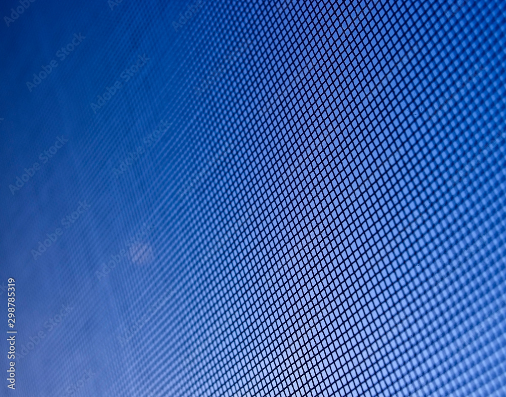 Fly screen mesh against blue sky