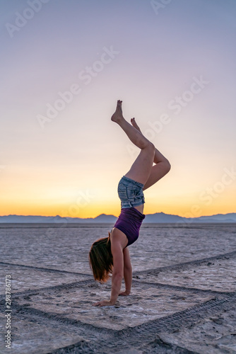 Beautiful Woman Doing Handstands In The Bonneville Salt Flats