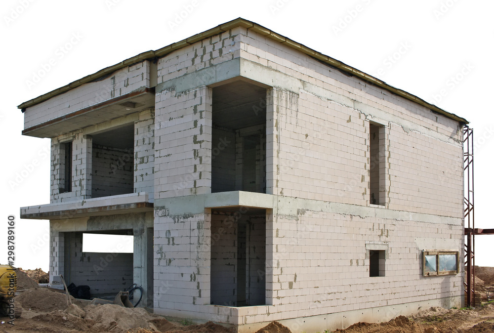 The building of unfinished rural house from white bricks sand and concrete isolated The building of unfinished rural house from white bricks sand and concrete isolated