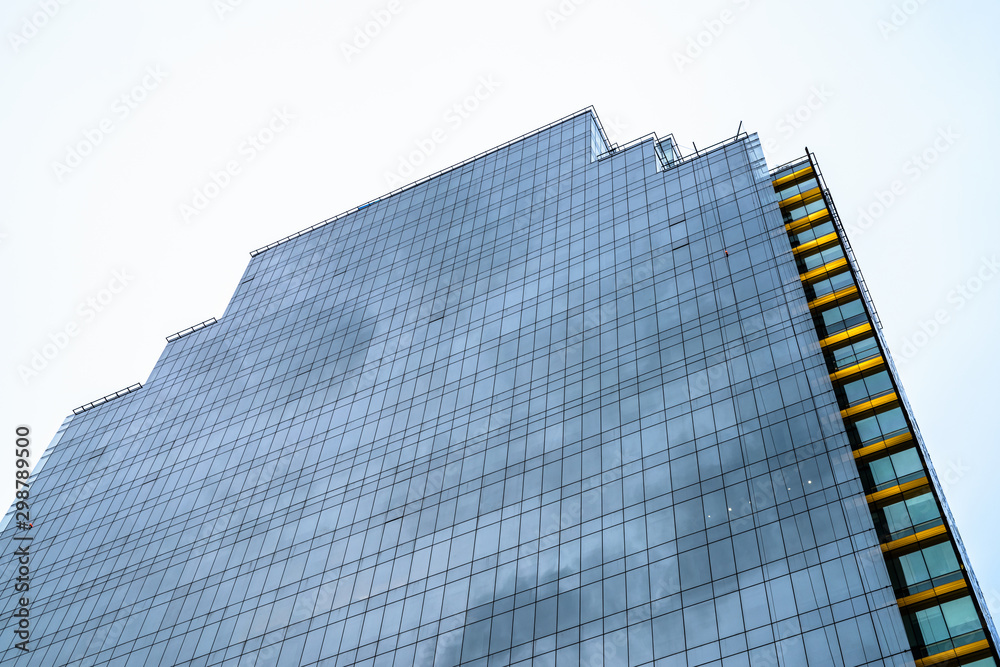 Naklejka premium Low Angle View Of Tall Corporate Building