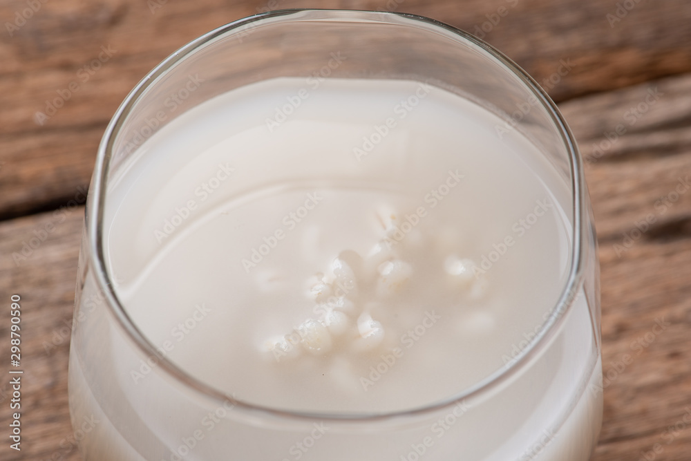 Barley water in glass with raw and cooked Barley water in glass with raw and cooked