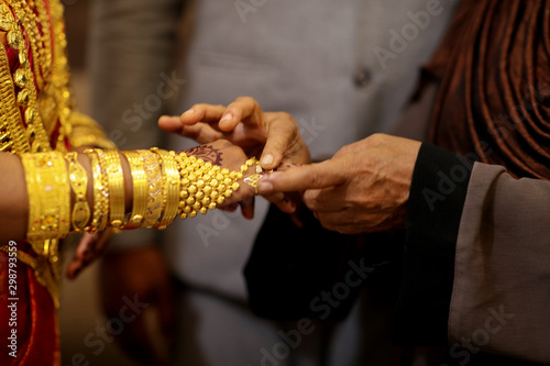 indian bride getting her ring