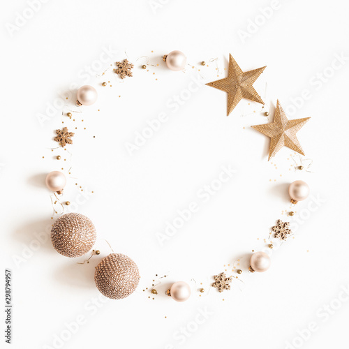 Christmas composition. Wreath made of golden decorations on white background. Christmas, winter, new year concept. Flat lay, top view, copy space, square