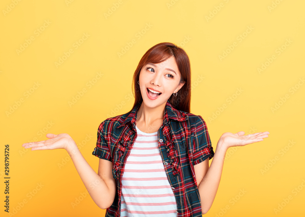 young woman Smiling and showing both hands open palms young woman Smiling and showing both hands open palms