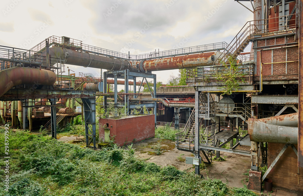 Industrial factory in Duisburg, Germany. Public park Landschaftspark, landmark and tourist attraction. Industrial factory in Duisburg, Germany. Public park Landschaftspark, landmark and tourist attraction.