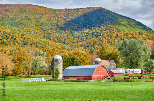 Farm with red barn and silos at sunny autumn day in West Arlington, Vermont, USA photo