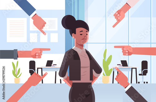 depressed businesswoman being bullied surrounded by hands fingers mocking her peer violence bullying social anxiety concept modern office interior flat portrait horizontal vector illustration