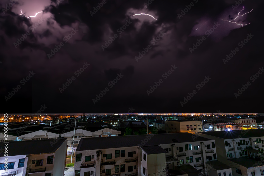 A lightning bolt stretches across the night sky.