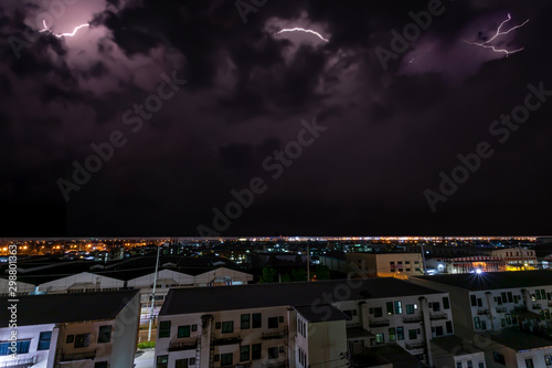Obraz na płótnie A lightning bolt stretches across the night sky. w salonie