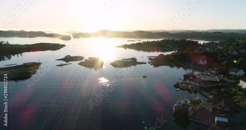 Aerial viev ofsunset over idyllic islands and small houses in south Norway. Langenes. photo