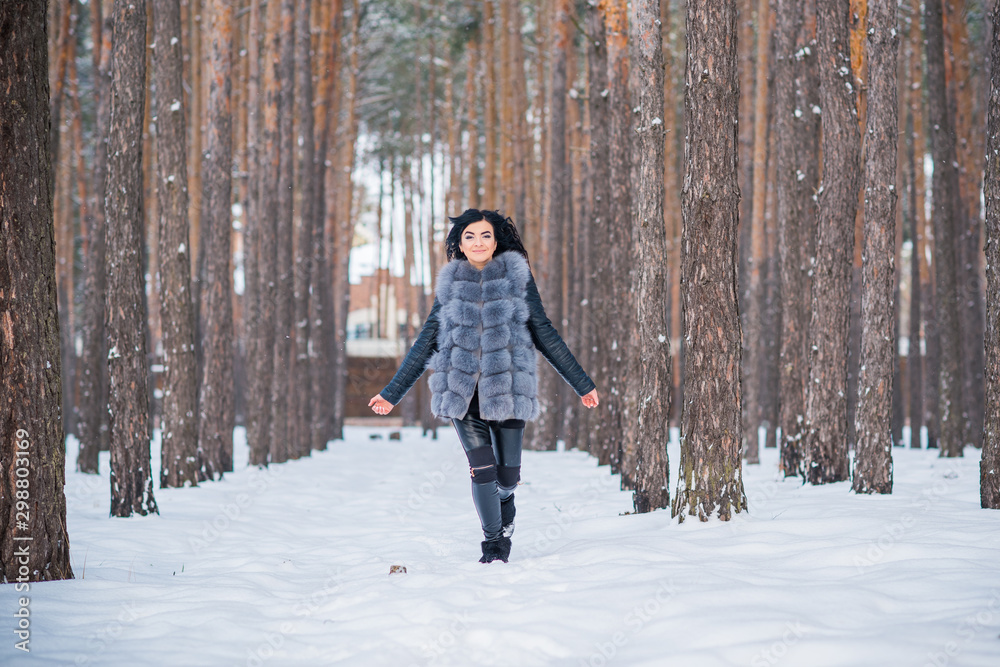 Happy woman at Holiday having fun at winter snowy day, concept of positive mood