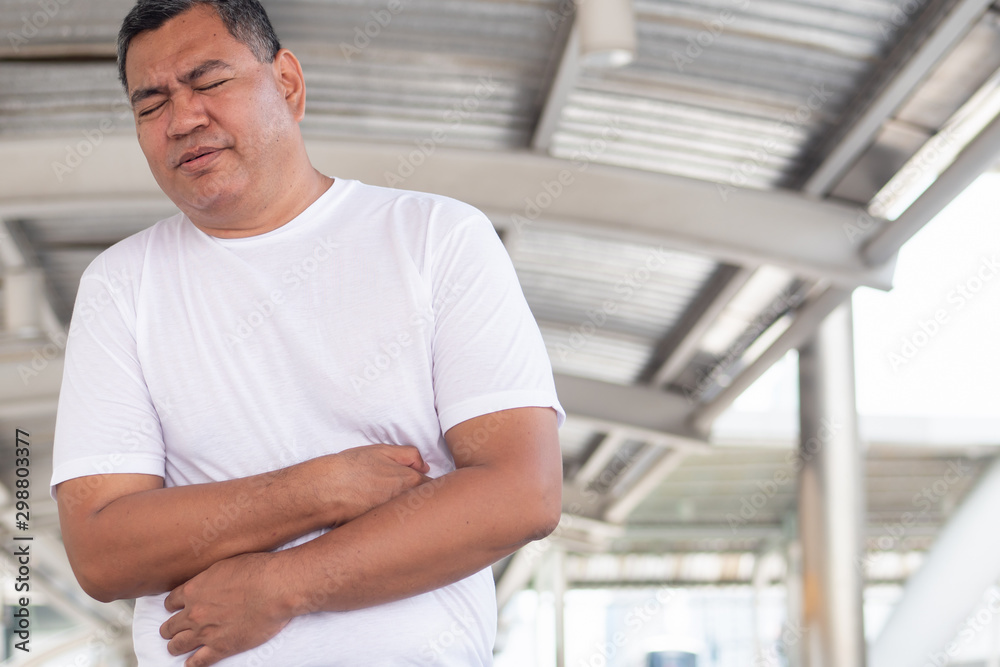 old senior man with stomach ache; retired man suffering from stomachache, abdominal pain, diarrhea; constipation; food poisoning, gastritis, acid reflux; stomach cancer old senior man with stomach ache; retired man suffering from stomachache, abdominal pain, diarrhea; constipation; food poisoning, gastritis, acid reflux; stomach cancer
