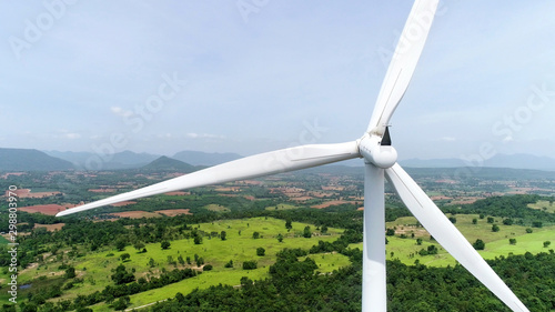 Wind turbine is alternative electrical power with blue sky, summer field, renewable energy