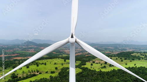 Wind turbine is alternative electrical power with blue sky, summer field, renewable energy