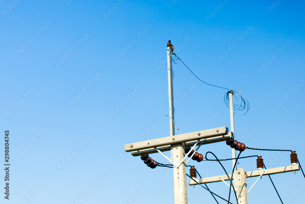 Electrical pole on the blue sky background Electrical pole on the blue sky background
