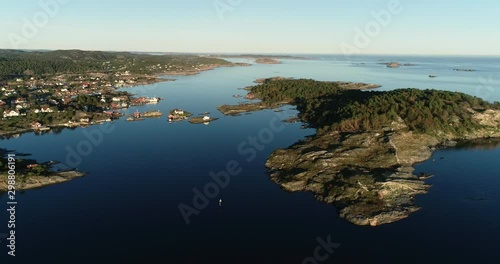 Aerial viev of sunset over rocky south norwegian coast.  photo