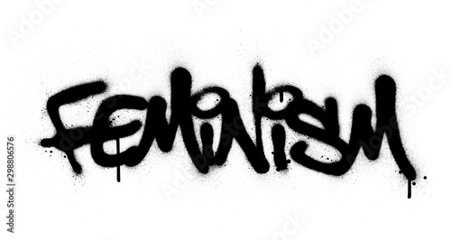 graffiti feminism word sprayed in black over white