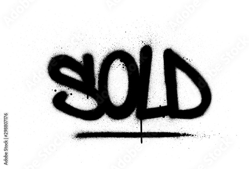 graffiti sold word sprayed in black over white