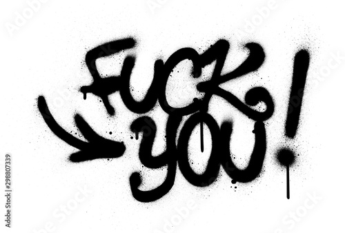 graffiti fuck you text sprayed in black over white