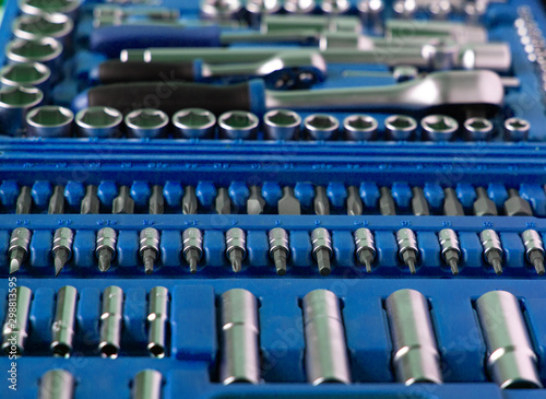 A lot of different tools in the dark blue box. Tools for home workers, factory workers, auto mechanics and other works.