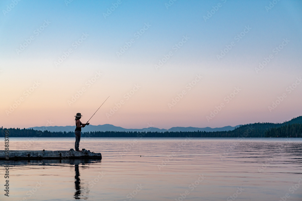 Woman Fishing in Lake Tahoe During Sunset