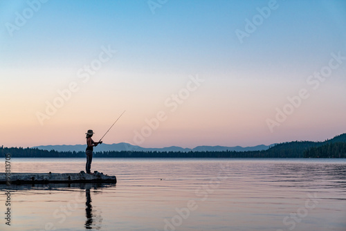 Woman Fishing in Lake Tahoe During Sunset